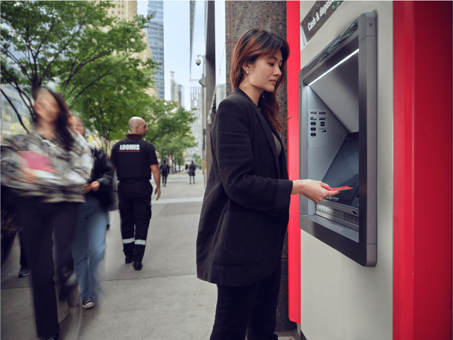 woman-withdrawing-cash-from-a-loomis-atm-in-the-street